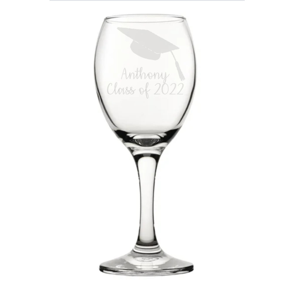 A 340ml/11.5oz wine glass engraved with a graduation cap with the name of your choice underneath. Followed by Class of (Year of your choice). 